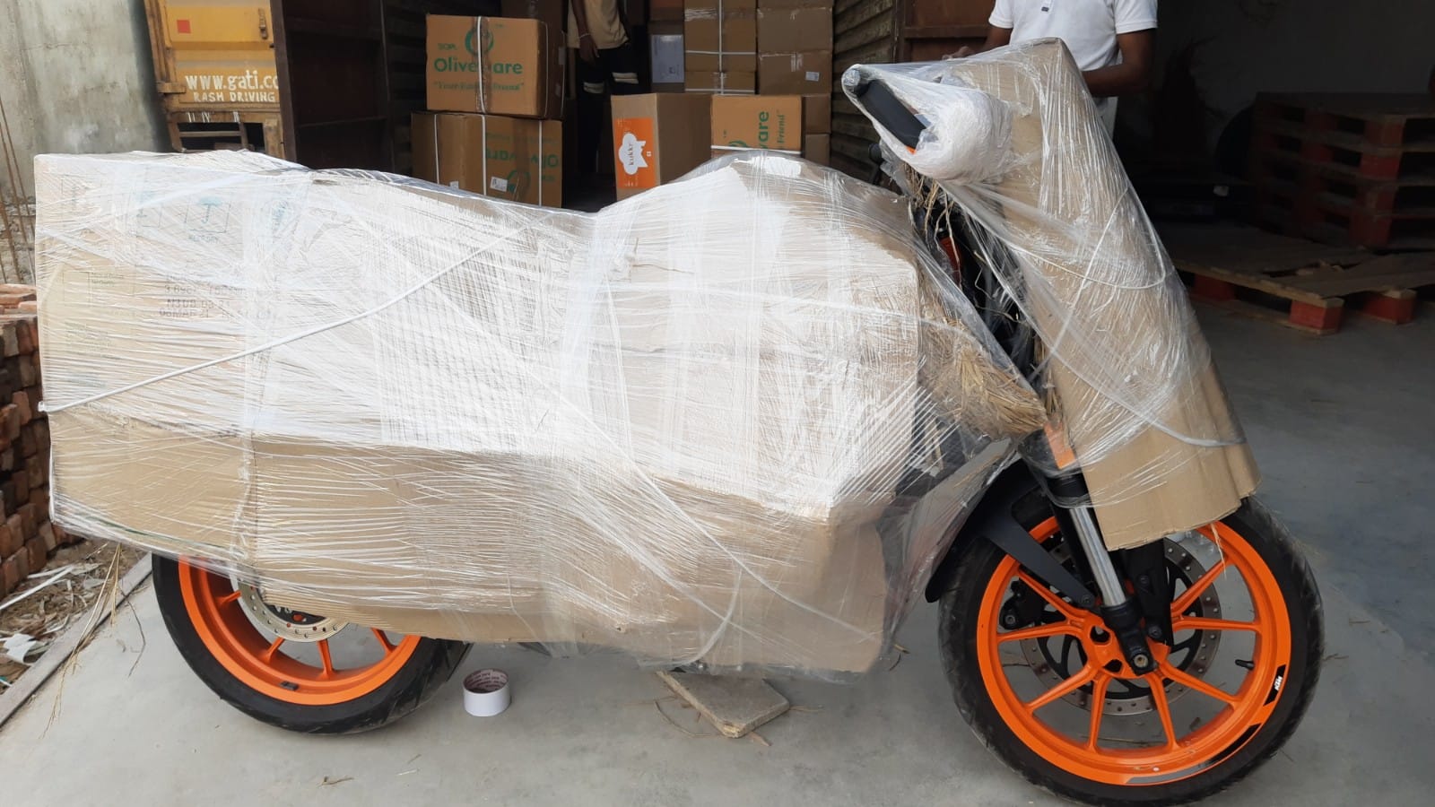 Two-wheeler securely crated and wrapped for motorcycle transport